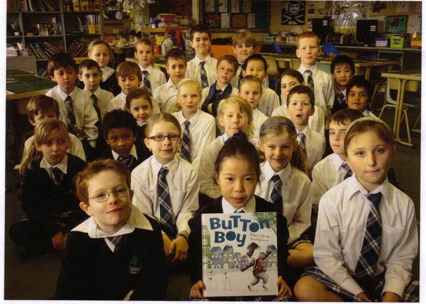 Yidarra Catholic Primary School students with a copy of Button Boy. (Photo © K Price) Yidarra Catholic Primary School students with a copy of Button Boy. Photo © K Price