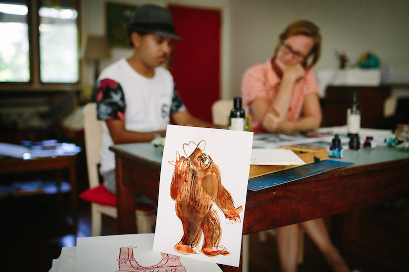 Joshua and Robyn creating a picture book together.