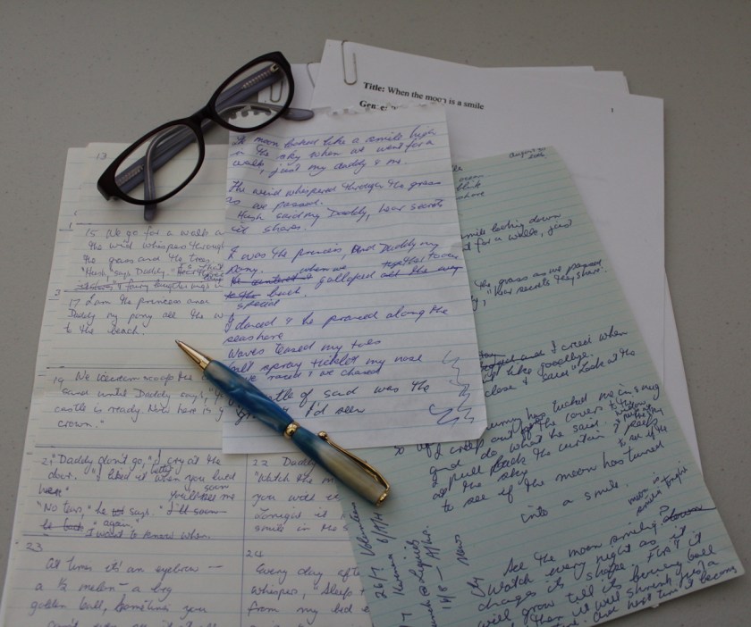 Drafts of When the Moon is a Smile, a pile of paper with scribbled notes.