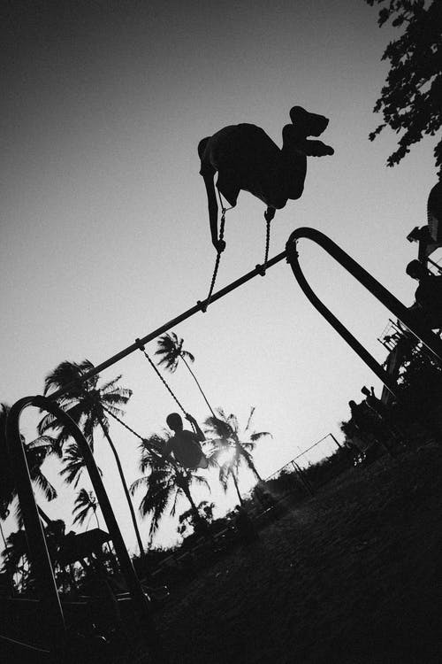 Children on swings at a park. Image courtesy pexels.com
