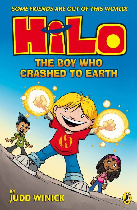Image shows the cover of a children's book: HiLo, The Boy Who Crashed to Earth by Judd Winick. The cover illustration shows a boy with yellow hair, a red shirt with a letter H on it, blue jeans and sneakers. He's holding his hands up in the air and each hand is in a fist, circled with yellow glow. Behind him is a boy with short black hair and a girl with brown skin and a pink shirt. They are all standing on a road.