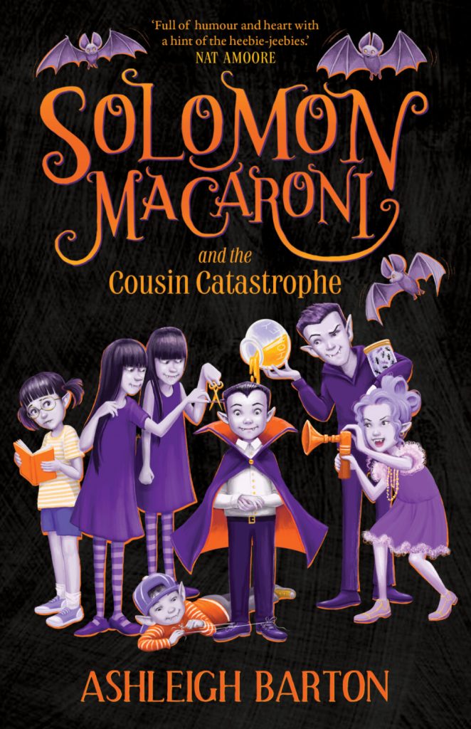 Image shows the cover of a children's novel: Solomon Macaroni and the Cousin Catastrophe by Ashleigh Barton. The cover is black and Solomon and his cousins are drawn in grey, purple and orange. There are purple bats the top of the cover. Solomon looks like a vampire in a purple cape lined with orange, short black hair that comes to a point over his forehead and fangs. The cousin behind him is pouring orange liquid onto Solomon's head from a glass bowl. Twin girl cousins in purple pinafores are about to cut off Solomon's ear with a pair of scissors. A young cousin in a purple cap is lying at Solomon's feet tying his shoelaces together. A girl in a purple dress and necklace of beads is pointing an airhorn at Solomon. And a girl in a yellow striped shirt and hair in pigtails stands off to one side reading an orange book and looking over her shoulder uncertainly at the others.