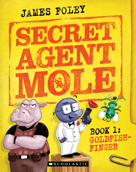 Image shows the cover of a graphic novel for young readers: Secret Agent Mole (book 1) - Goldfish-Finger by James Foley. The cover is predominantly yellow and features an illustration of ahippo in a brown vest with her arms crossed, a purple mole in a white tuxedo and wearing square glasses and holding a toy rubber-dart gun, and a tiny green flying bug wearing a hat. The typeface of the font suggests this is a spy-themed book.